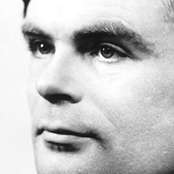 A black and white photograph of Alan Turing. A close-up side profile of Alan Turing, a middle aged white man, looking into the distance.