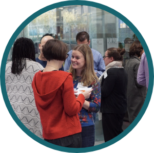 What We Do For Faculty Icon Photo of participants networking at an event