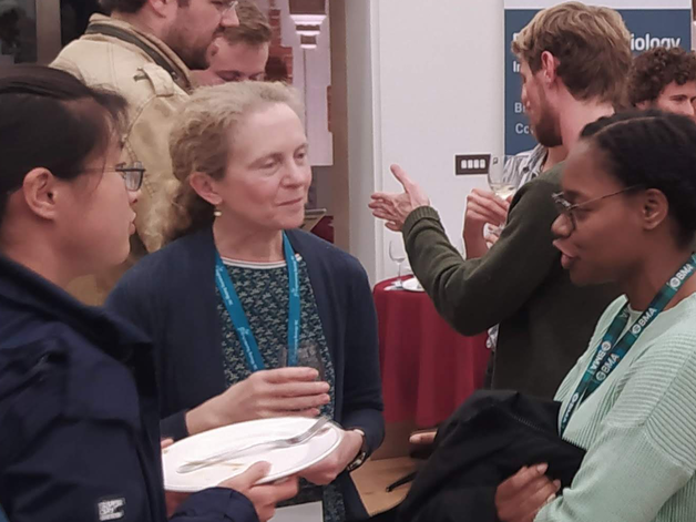 Image of people speaking at event