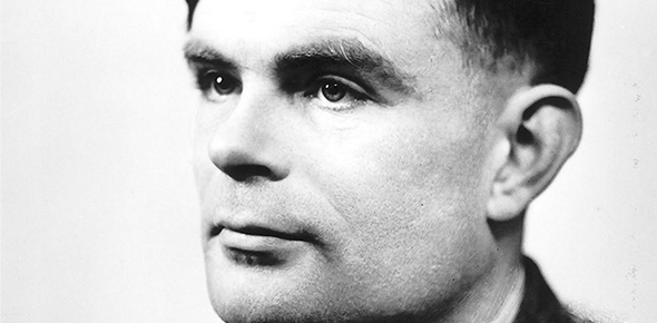 A black and white photograph of Alan Turing. A close-up side profile of Alan Turing, a middle aged white man, looking into the distance.